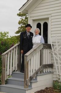 Couple on porch at Historic Village, Mackinaw City