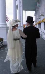 Lisa and Nate stroll the porch of the Grand Hotel