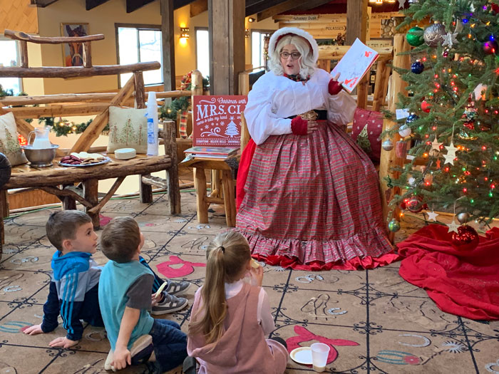 Mrs Santa Claus reading to children