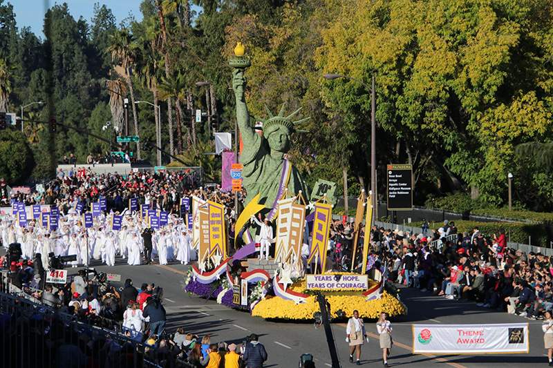Pasadena Celebrates 2020 Rose Parade Float and walkers on the parade route