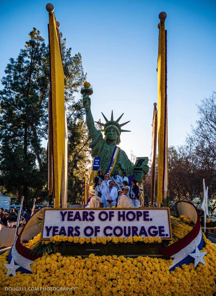Front view of the Pasadena Celebrates 2020 Rose Parade float with suffrage descendants and VIPs on board.