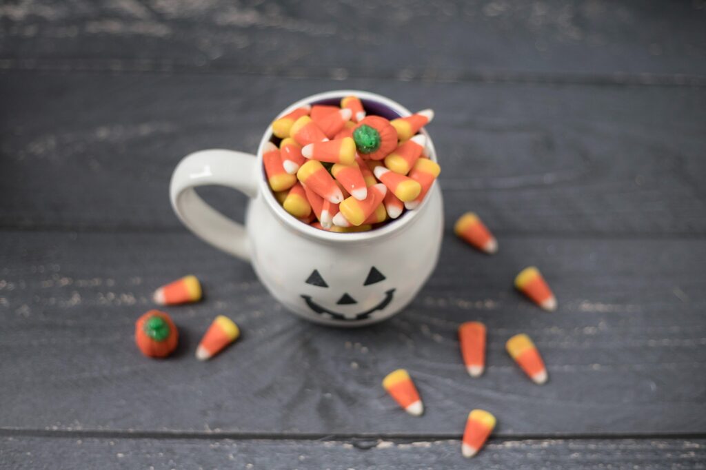 white mug filled with candy corn