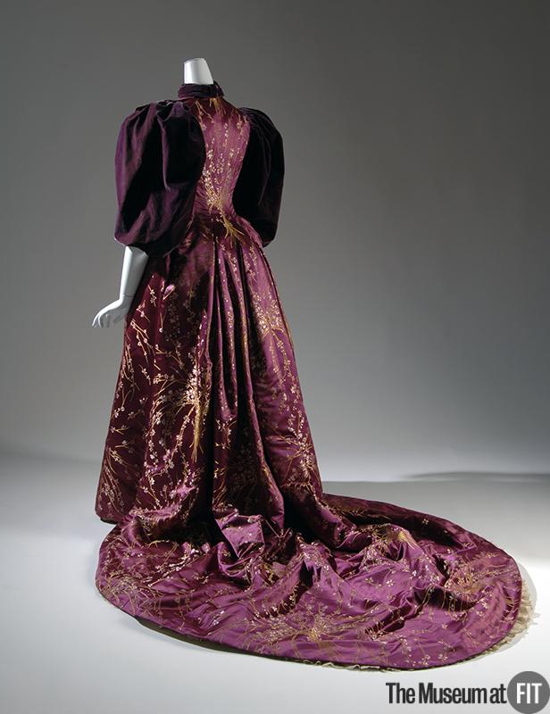 1894 evening dress of magenta floral brocade with plum velvet